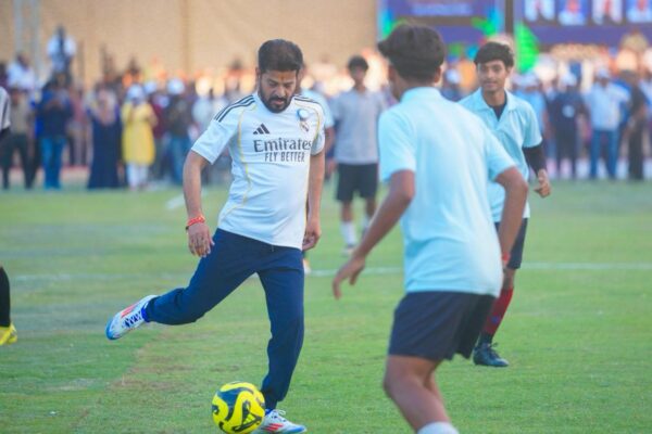CM Revanth Reddy playing football