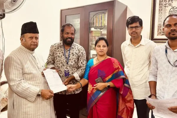 Booth Level Officer giving the SIR 2026 Enumeration Form to Charminar MLA Mir Zulfiqar Ali in Hyderabad during the Special Intensive Revision of electoral rolls.