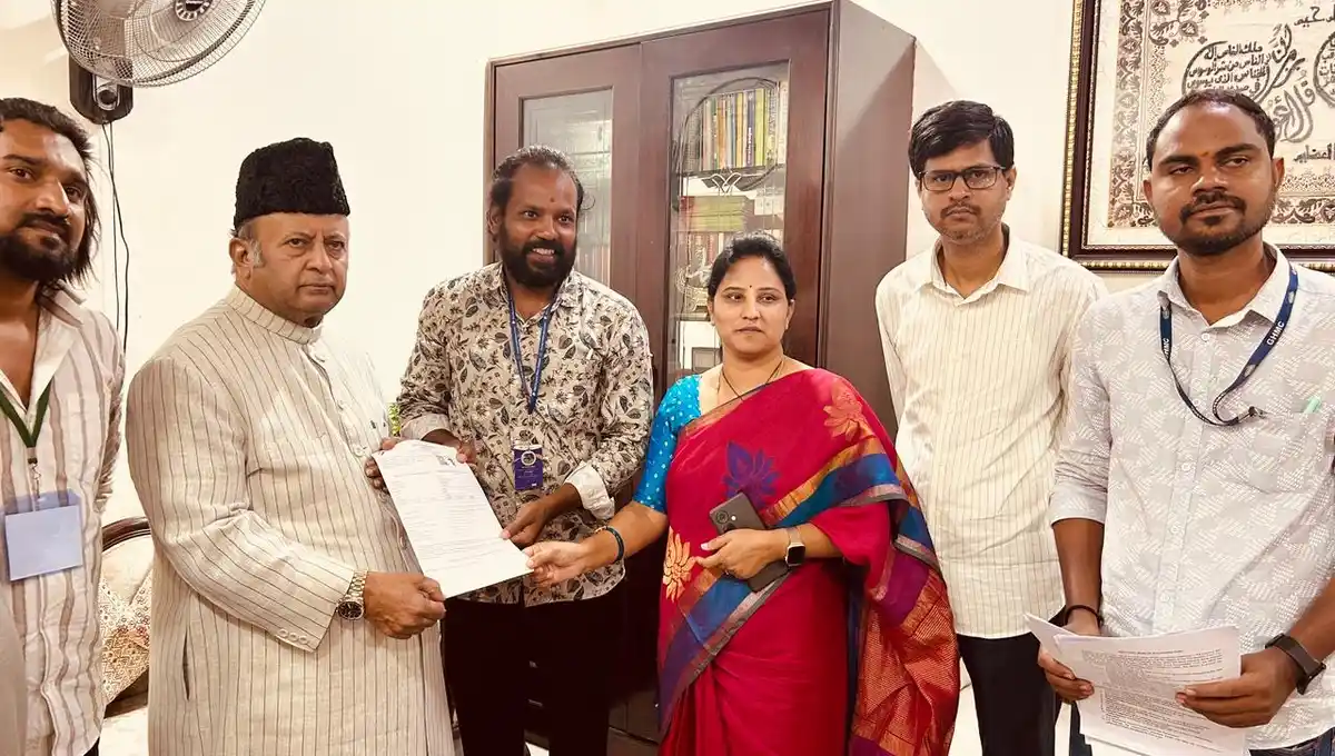 Booth Level Officer giving the SIR 2026 Enumeration Form to Charminar MLA Mir Zulfiqar Ali in Hyderabad during the Special Intensive Revision of electoral rolls.